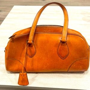 Prada luggage colored bag.  Used.